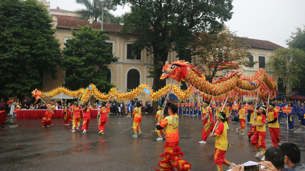 A procession of lion dancers perform at a Vietnam Mid-Autumn Festival